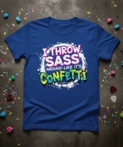 I Throw Sass Around Like It's Confetti quote on a royal blue t-shirt, featuring bold pink and green graffiti-style lettering