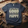 I Try To Be Good But I Take After My Pappy quote on a navy t-shirt, featuring distressed typography and