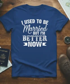 I Used To Be Married But I'm Better Now text in distressed white font on a royal blue t-shirt, celebrating