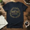 Navy t-shirt with gold text "I WANT YOU i just can’t flirt..." inside a floral wreath design