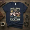 Navy t-shirt with "I Want a Coffee, A Tattoo and a Vacation" text and graphics of coffee cup, anchor, waves