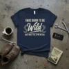 Navy t-shirt with white text "I WAS BORN TO BE Wild (BUT ONLY TILL 9PM OR 50)" design featuring decorative