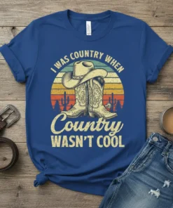 I Was Country When Country Wasn't Cool t-shirt with cowboy boots, hat, and retro sunset graphic