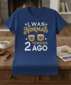 I WAS NORMAL 2 YORKIES AGO text with two cute Yorkshire Terrier dog faces and paw prints on a navy