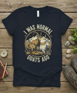 I Was Normal Goats Ago t-shirt with vintage illustration of three goats on a mountain landscape