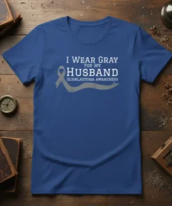 I Wear Gray For My Husband Glioblastoma Awareness text with gray ribbon graphic on blue t-shirt