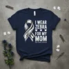 Navy blue t-shirt with white text "I Wear Zebra For My Mom" and a zebra-striped awareness ribbon. Includes "Rare Disease
