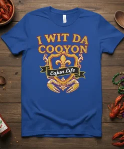 Blue t-shirt with "I Wit Da Cooyon Cajun Life" text and Cajun-themed graphics including crab claws and fleur-de-lis