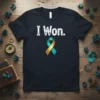 Dark navy t-shirt with white text "I Won." and a teal and gold awareness ribbon graphic