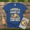 Blue t-shirt with the quote "I Wonder If Ginger Ale Thinks About Me Too" and graphics of ginger roots and