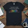 Black t-shirt with white text "I wonder what my job description says today" above a rainbow pencil graphic and "#instructionalcoach"