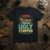 Black t-shirt with bold text: "I WORK Harder THAN AN UGLY STRIPPER" in vintage colors, featuring gears and stars
