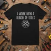 Black t-shirt with white text "I Work With A Bunch Of Tools" and a circular graphic of crossed wrenches and