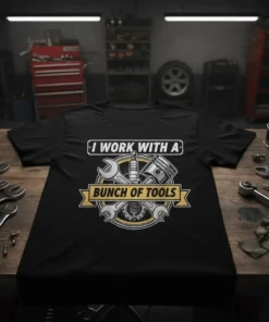 Black t-shirt with "I Work With A Bunch Of Tools" text and graphic of tools, piston, and spark plug
