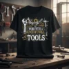 Black t-shirt with white and gold text "I Work With A Bunch Of Tools Tools" surrounded by various wrenches, gears