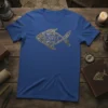 Blue t-shirt featuring a golden ornate fish design with the Greek word ΙΧΘΥΣ inside, representing the Christian Ichthys symbol