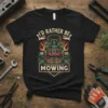 I'd Rather Be Mowing T-Shirt with a graphic of a lawn mower surrounded by flames and grass