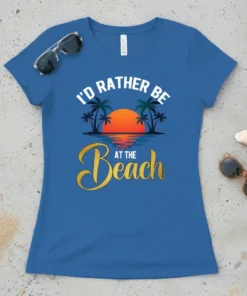 I'd Rather Be At The Beach text with palm trees and sunset graphic on a blue t-shirt