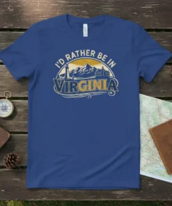 I'd Rather Be In Virginia text with lighthouse, mountains, and buildings graphic on a blue t-shirt