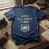 Navy t-shirt with "If Found Please Return To Library" text and an open book graphic