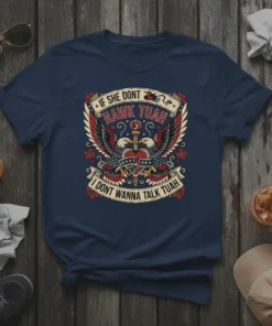 If She Don't Hawk Tuah I Don't Wanna Talk Tuah quote with eagles and heart graphic on a navy t-shirt