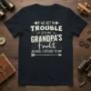 If We Get In Trouble It's My Grandpa's Fault Because I Listened To Him quote on a navy t-shirt with