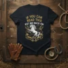 T-shirt with "If You Can Read This Put Me Back On" text and a white horse graphic with golden horseshoes