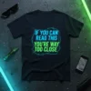 T-shirt with the neon-style text "IF YOU CAN READ THIS YOU'RE WAY TOO CLOSE" in blue and green on a