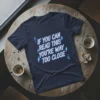 Navy t-shirt with neon blue text "IF YOU CAN READ THIS YOU'RE WAY TOO CLOSE" and lightning bolt graphics