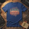 If You Need Me I'll Be In The Garage text design with wrench and gear graphic on a blue t-shirt