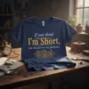 Navy blue t-shirt with "If you think I'm Short, you should see my patience" quote in gold and white, featuring