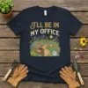Gardening t-shirt with "I'll Be In My Office" text and a colorful illustration of a garden path, wheelbarrow, and watering