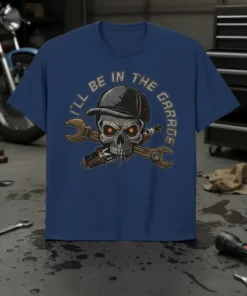 T-shirt with "I'll Be In The Garage" text, featuring a skull wearing a cap, holding wrenches and a spark plug