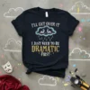 T-shirt with the quote "I'll Get Over It I Just Need To Be Dramatic First" featuring a sad cloud graphic