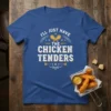 T-shirt with the text "I'll Just Have The Chicken Tenders" in bold white and yellow font, featuring chicken drumstick graphics