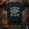 Black t-shirt with white and orange text that says "I'LL PUT YOU IN THE TRUNK AND HELP PEOPLE LOOK FOR