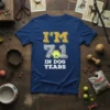 T-shirt with "I'm 71 In Dog Years" text and a yellow paw print graphic