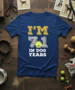 T-shirt with "I'm 71 In Dog Years" text and a yellow paw print graphic