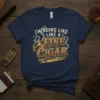 I'm Aging Like Like A Fine Cigar text with a smoking cigar graphic on a navy t-shirt