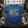 T-shirt with "I'M AUTISTIC WHAT'S WHAT'S YOUR EXCUSE?" text in vibrant, colorful typography. Features abstract geometric graphics and a distressed