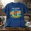 I'M AVERY DOING AVERY THINGS custom name t-shirt with bold orange and yellow lettering and teal paint splatter design
