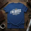 Blue t-shirt with white text "I'M BOSS AROUND HERE" and a gold crown above gears graphic