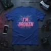 I'm Broken t-shirt design with pink glitch text over a digital circuit board pattern on a blue shirt