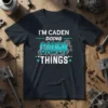 I'm Caden Doing Caden Things personalized name t-shirt with turquoise 3D text and gear graphics