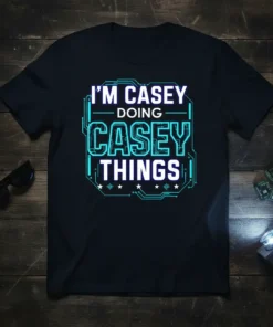 I'm Casey Doing Casey Things text design with blue circuit board graphics on a black t-shirt