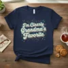 T-shirt with the text "I'm Clearly Grandma's Favorite" in retro lettering with colorful accents