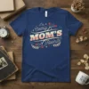 I'm Clearly MOM'S Favorite t-shirt with retro floral accents and playful typography in cream, pink, and teal