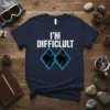 Navy t-shirt with white distressed text "I'M DIFFICULULT" above two blue diamond ski slope markers