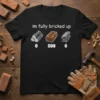 Black t-shirt with white text "im fully bricked up" and graphics of logs, bricks, and metal bars with numbers 0