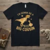 I'm Gonna Be A Big Big Cousin text with T-Rex and baby dinosaur graphic on a black t-shirt